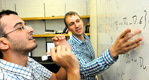 Shawn Shadden and Amir Arzani working on computations.