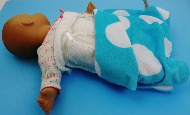 New wearable electronics will allow an infant to be swaddled in a blanket laced with a network of nearly weightless, printed “coils” for more comfortable, less expensive MRI scanning.